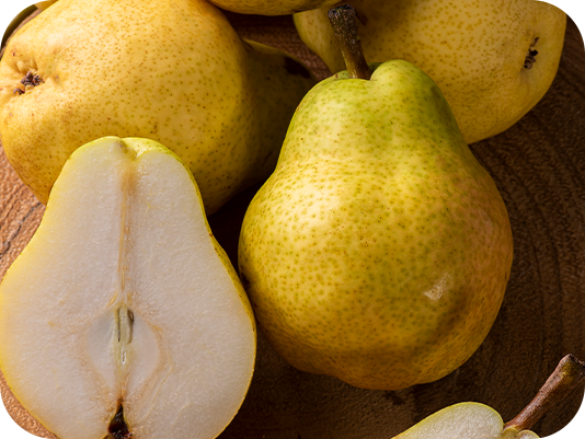 Fresh sliced pears on wood, top note ingredient