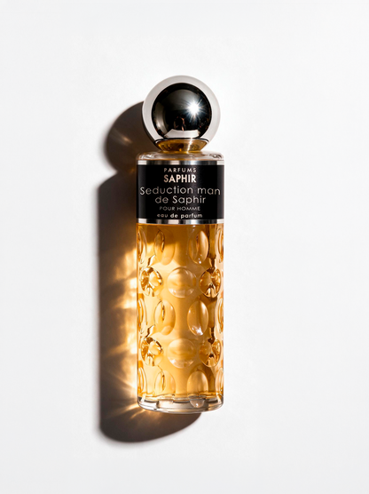 Seduction Man de Saphir eau de parfum for men, amber bottle on white background